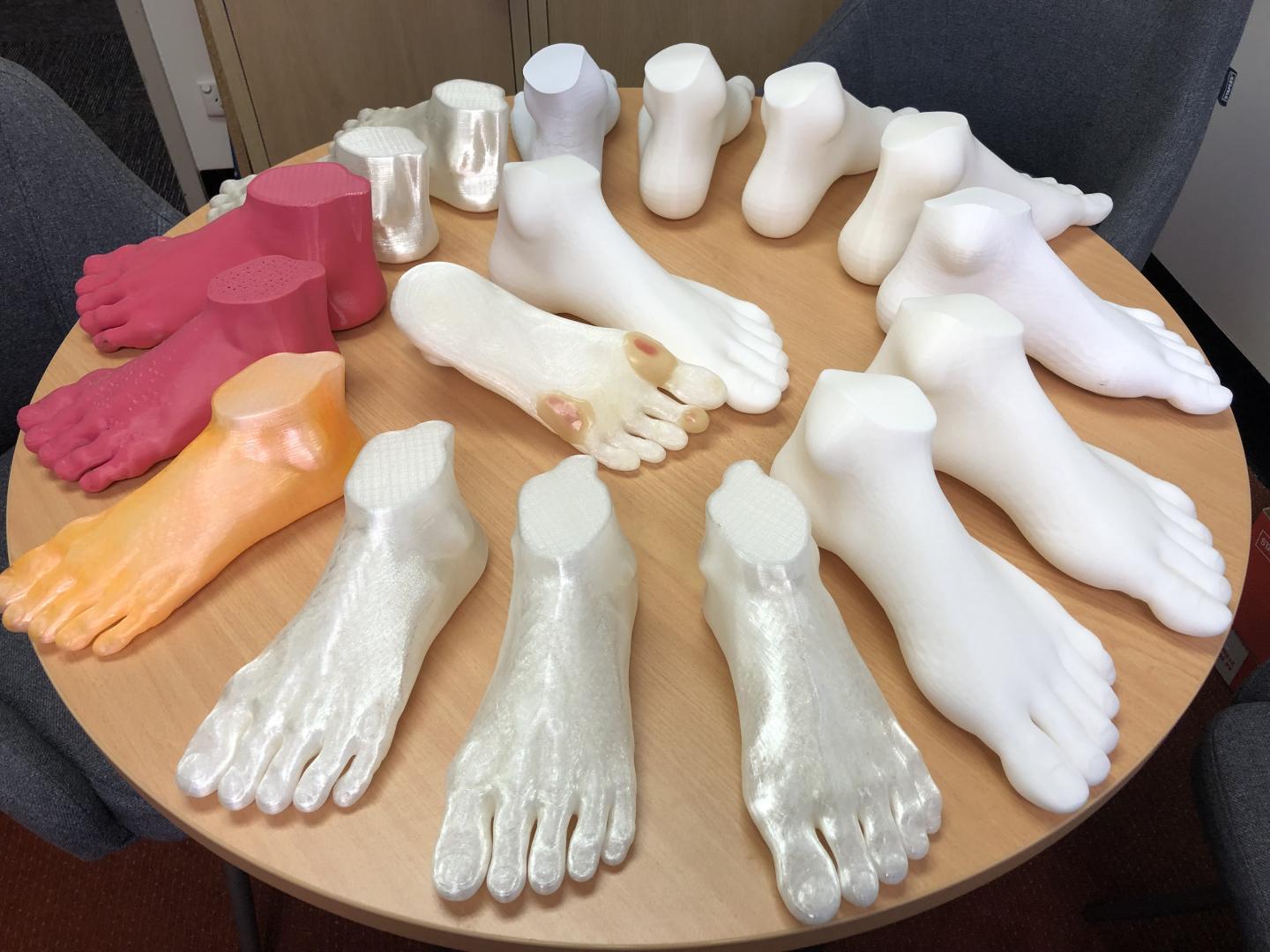 These are 3D-printed feet, some enhanced with foot ulcers
